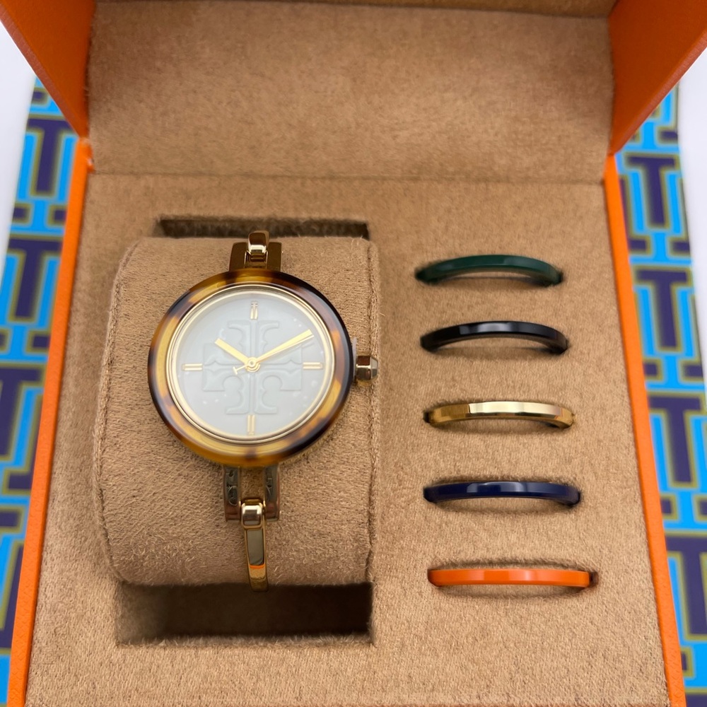 New Tory Burch Bracelet Watch with intercambiable rounds.